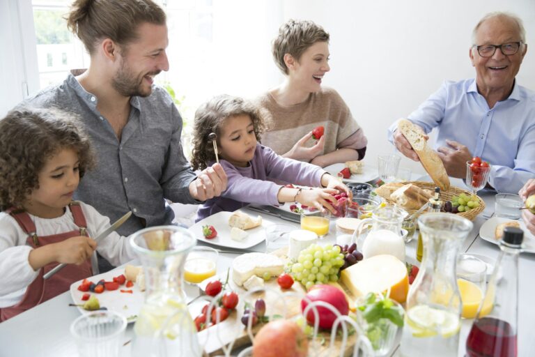 Happy extended family having lunch at home